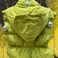 Miss Sparkling brand. Cropped puffer vest in chartreuse green, waist length and zip front with detachable hoodie.