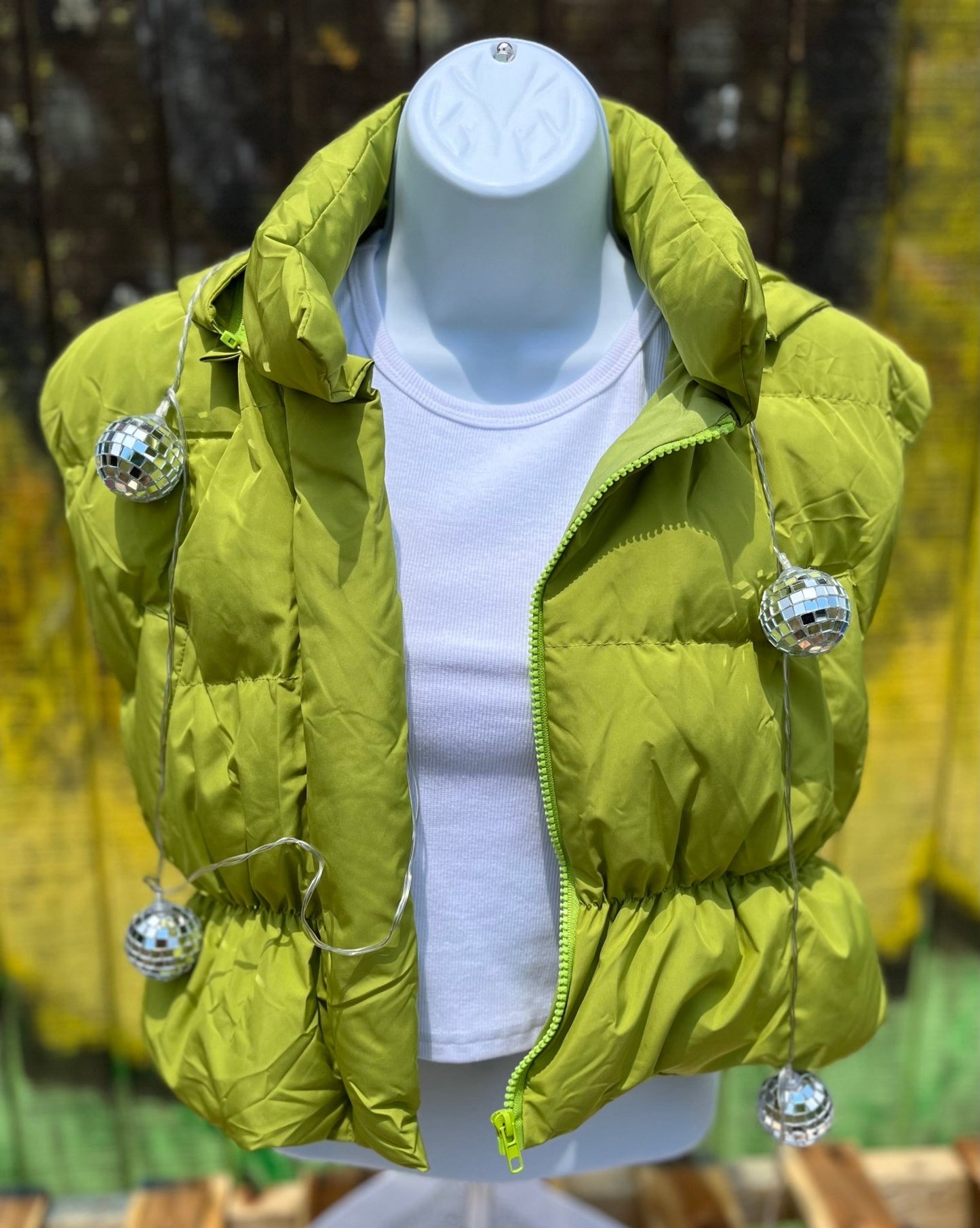 Miss Sparkling brand. Cropped puffer vest in chartreuse green, waist length and zip front with detachable hoodie.