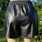 Cotton Bleu brand. Black faux leather loose fit shorts with elastic waist. Machine wash. S, M, L, XL. $25