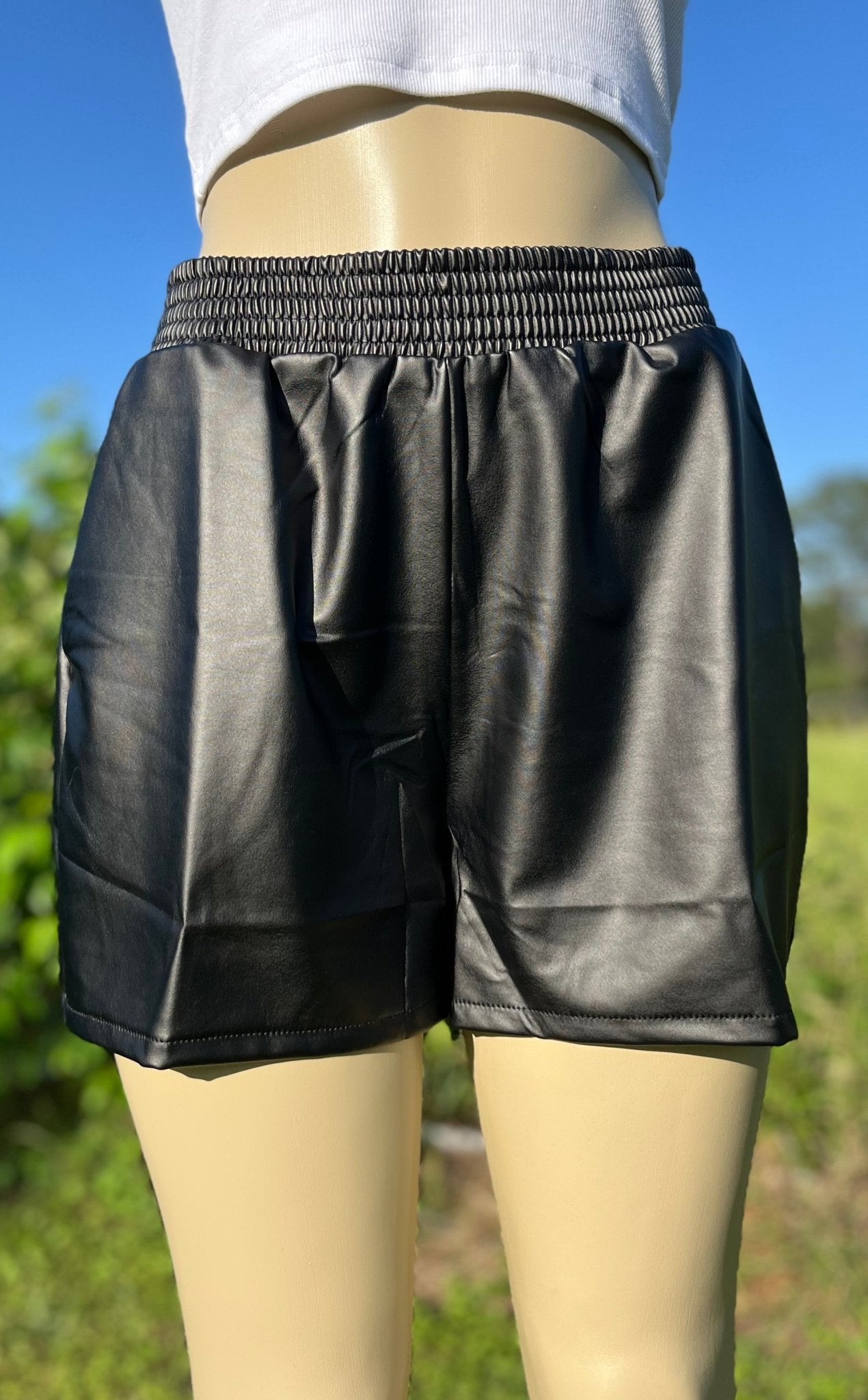 Cotton Bleu brand. Black faux leather loose fit shorts with elastic waist. Machine wash. S, M, L, XL. $25