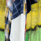 Features multicolored contrast patchwork flannel w/ waffle knit sleeves & banded navy opening w/ matching zipper & hood.