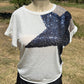 Vanilla Monkey brand. Beige knit top w/ large black sequined star & leopard print shoulder accent with short banded sleeves.