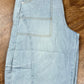 Blue B brand. These light wash cargo denim knee length shorts feature a mid-rise and exaggerated tapered slouchy fit.