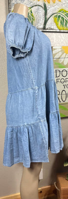 Shopin LA brand. This lightweight denim dress has elastic neckline and sleeves, tiered skirt and side pockets.