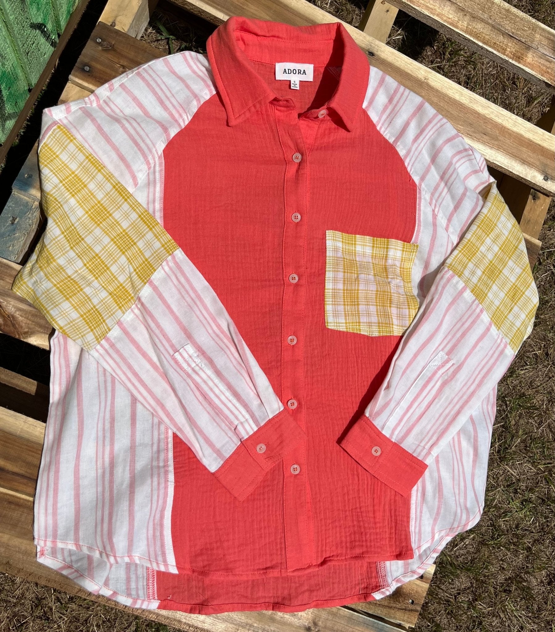 Color block blouse w/ solid, stripes, & plaid multicolored prints in deep coral, mustard & white textured design.