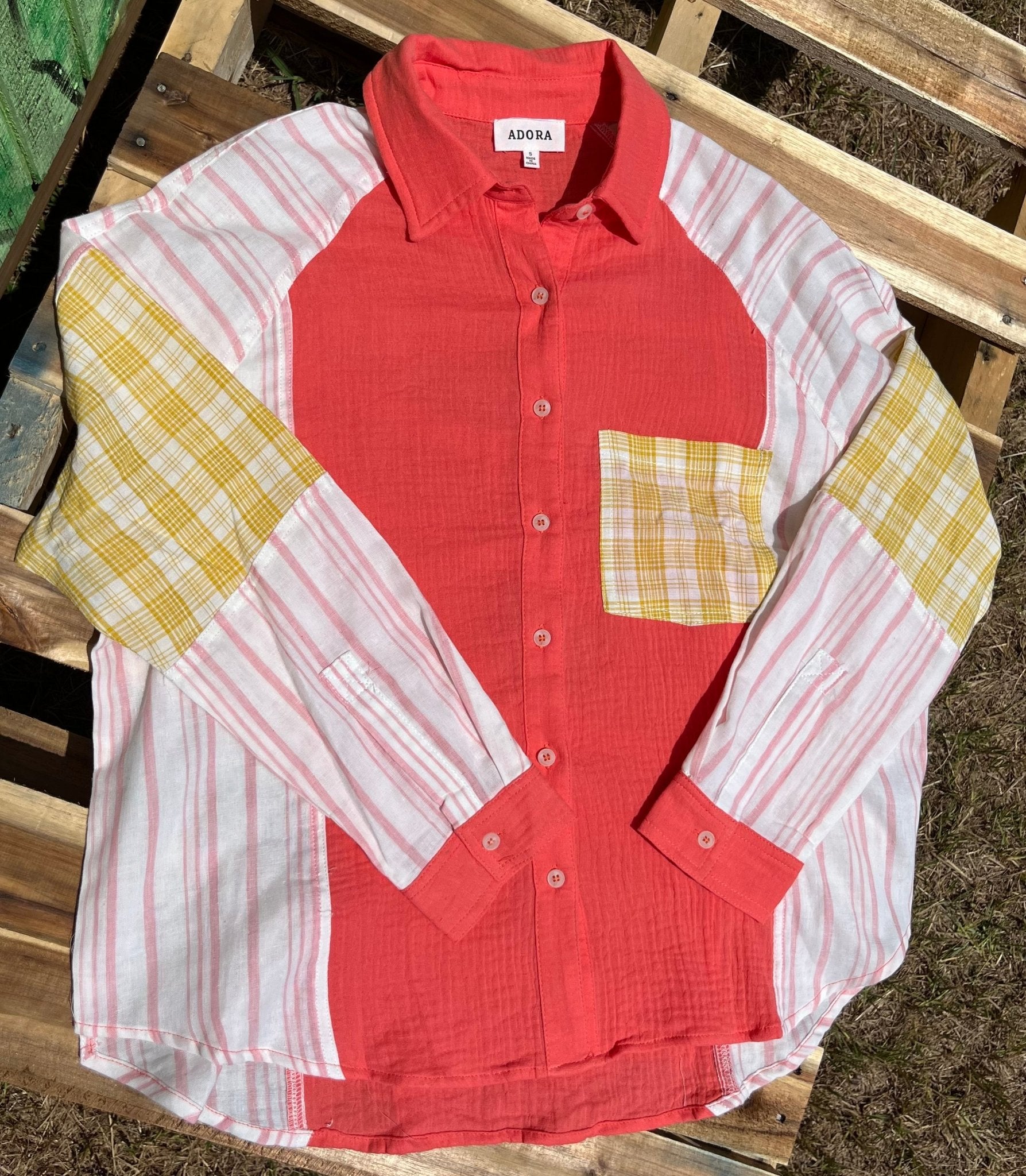 Color block blouse w/ solid, stripes, & plaid multicolored prints in deep coral, mustard & white textured design.