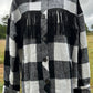 This fringe shacket is button down, buffalo plaid, with pockets & fringe detail. In red/black or white/black buffalo plaid.