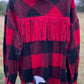 This fringe shacket is button down, buffalo plaid, with pockets & fringe detail. In red/black or white/black buffalo plaid.