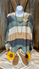 Vanilla Monkey brand. Long sleeved Dolman top with navy, olive, cream and tan stripes in loose knit fabric. S, L $20