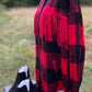 This fringe shacket is button down, buffalo plaid, with pockets & fringe detail. In red/black or white/black buffalo plaid.