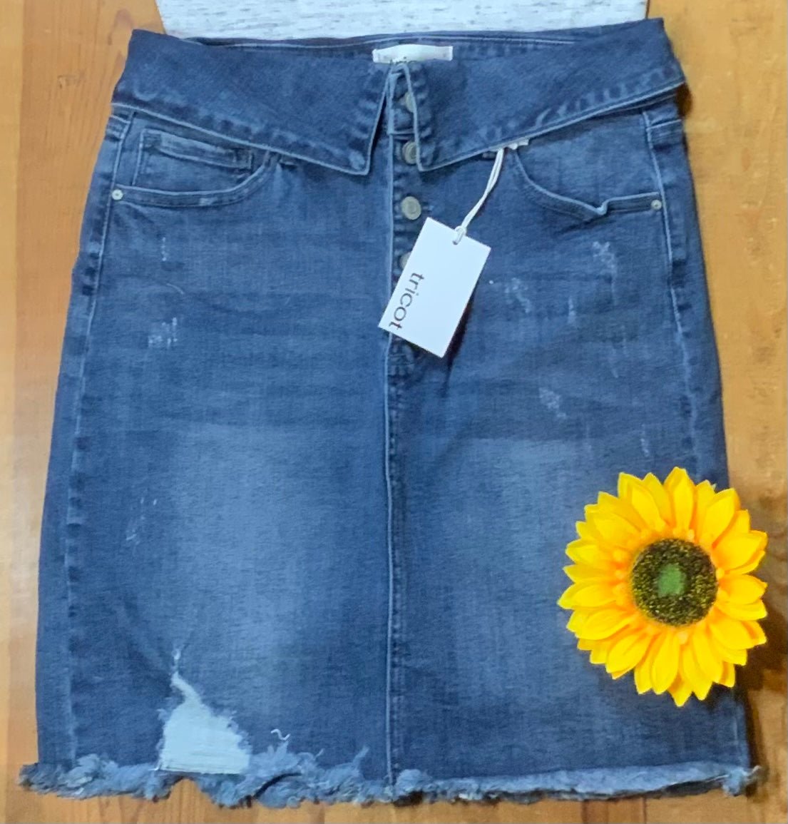 Urban Daisy brand. Distressed denim mini skirt with fold over button fly waist. S, M, L $38.75