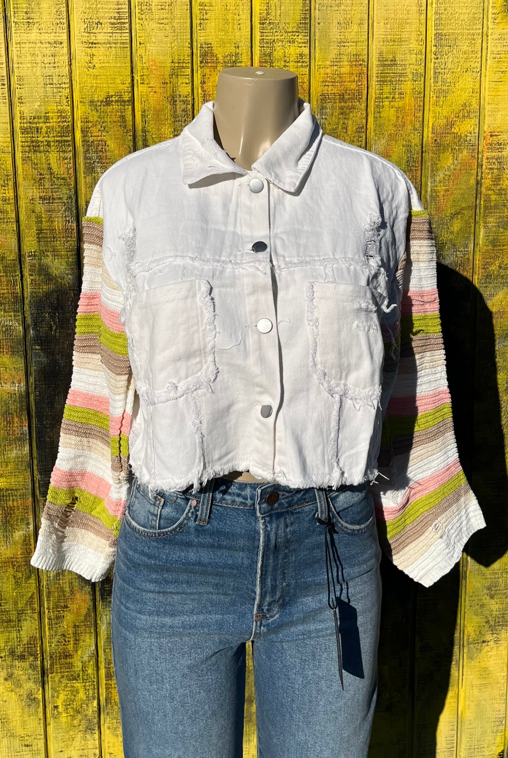 Bellissima Fashion brand. This distressed and frayed denim patchwork knit jacket boasts torn sleeves and metal buttons. 90% cotton. 10% polyester. S, M, L, XL. $47