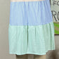 Shopin LA brand. Striped color blocked sundress with side pockets. Ruffle detail. White, pink, yellow/orange, blue and green.