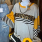 And the Why brand. This lightweight gray top with wide sleeves has mustard colored, white/black stripes,  leopard accents.