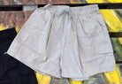 ADORA LA brand. Wide leg cargo shorts in khaki, black and gray. Lightweight with elastic drawstring waist and wide legs.