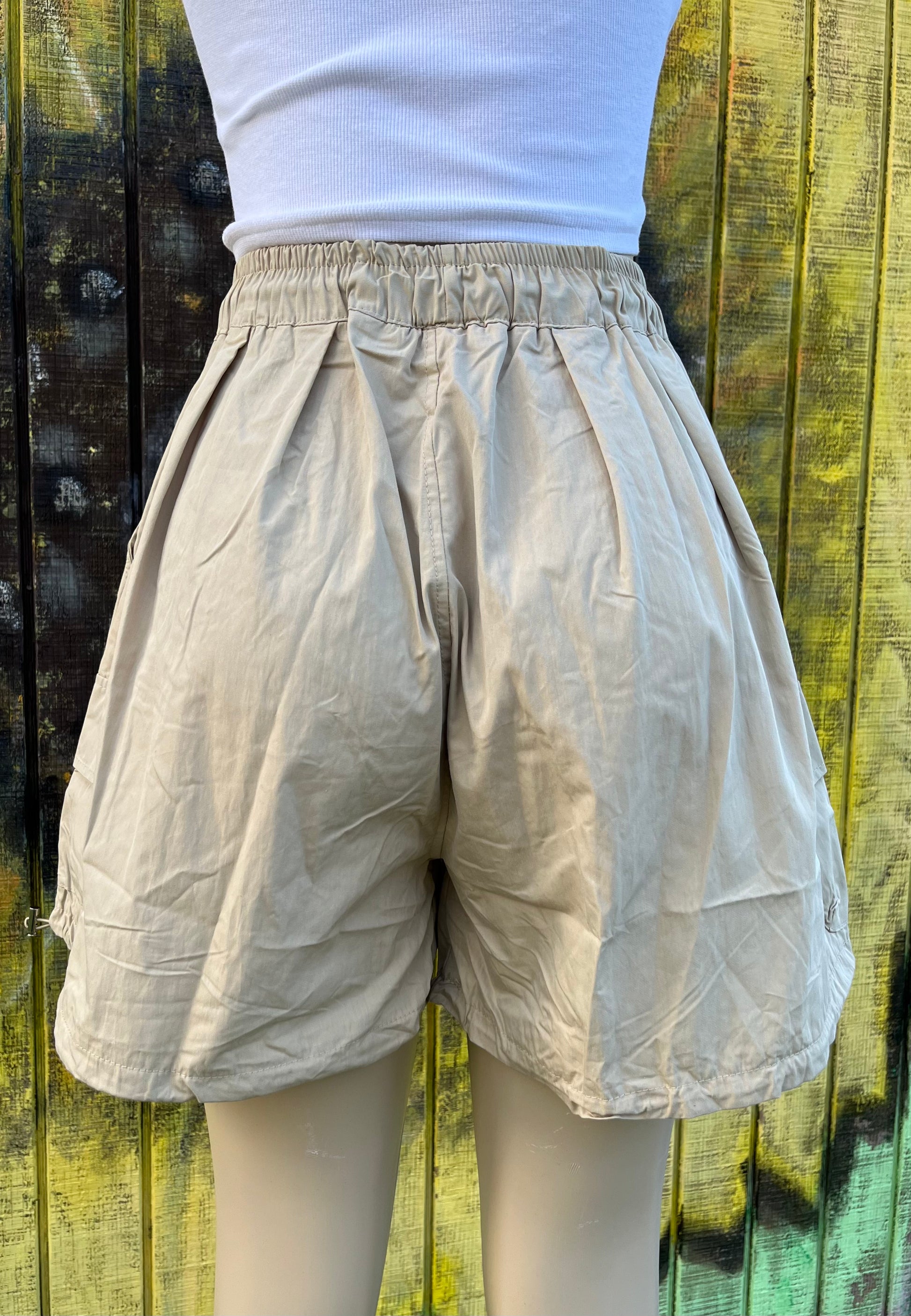 ADORA LA brand. Wide leg cargo shorts in khaki, black and gray. Lightweight with elastic drawstring waist and wide legs.