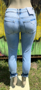 VERVET by Flying Monkey. Mid rise skinny jeans with distressed and hem tacking details.