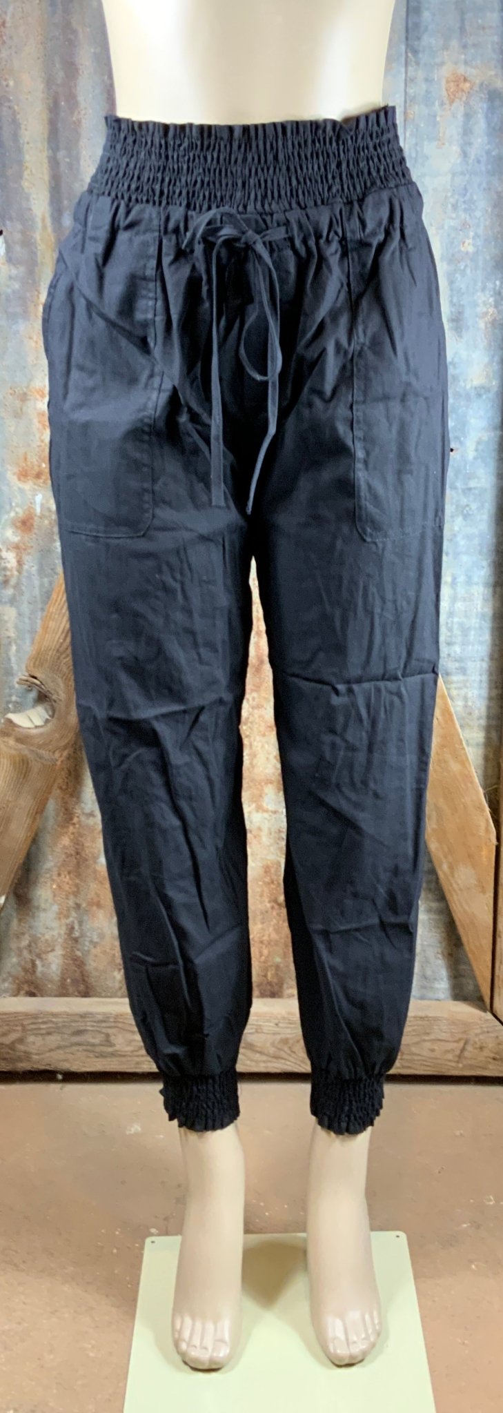 ESLEY brand. These black pants feature an elastic waist and ankle cuffs, drawstring waist tie and pockets. S, M, L $15