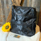 This lightweight backpack in camo or black has a roomy interior and zippered outside pouch. Bag measures 15" x 10" x 5".