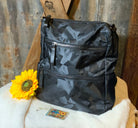 This lightweight backpack in camo or black has a roomy interior and zippered outside pouch. Bag measures 15" x 10" x 5".