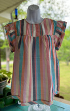 Crossed Arrows Clothing Co. brand. Multicolored stripes with smock top and capped ruffled sleeves. 100% polyester. S, M, XL $30