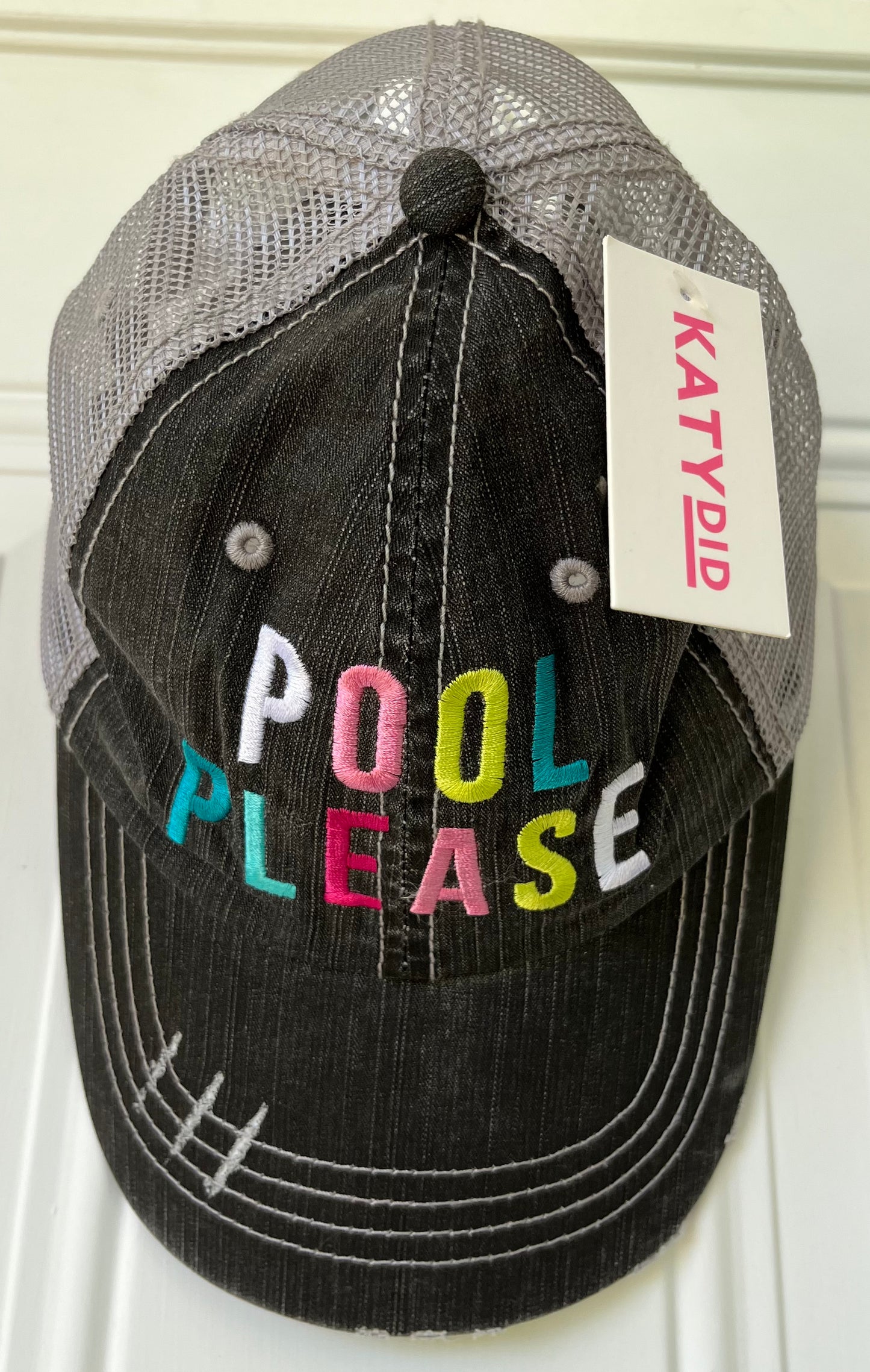 Katydid brand. Trucker hat with distressed curved bill and colorful embroidery with an adjustable Velcro fit.  $18