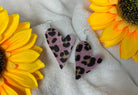 A Glamper's Creation, LLC brand. Silver dangle fuzzy pink and leopard heart earrings. $10