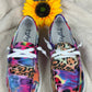 Multi-bright colored design with vibrant tiger and leopard print slip-ons. White lace detail. White lightweight soles.