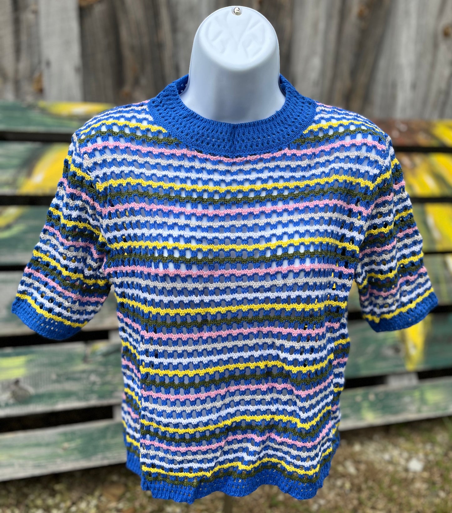 Miss Sparkling brand. Royal blue top with multicolored stripes and unique knit design that allows for subtle transparency. S, M, L, XL $27