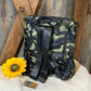 This lightweight backpack in camo or black has a roomy interior and zippered outside pouch. Bag measures 15" x 10" x 5".