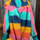 Katydid brand. Lightweight rainbow hoodie wrap with pockets in aqua, navy, pink, gold and orange. One size. $30