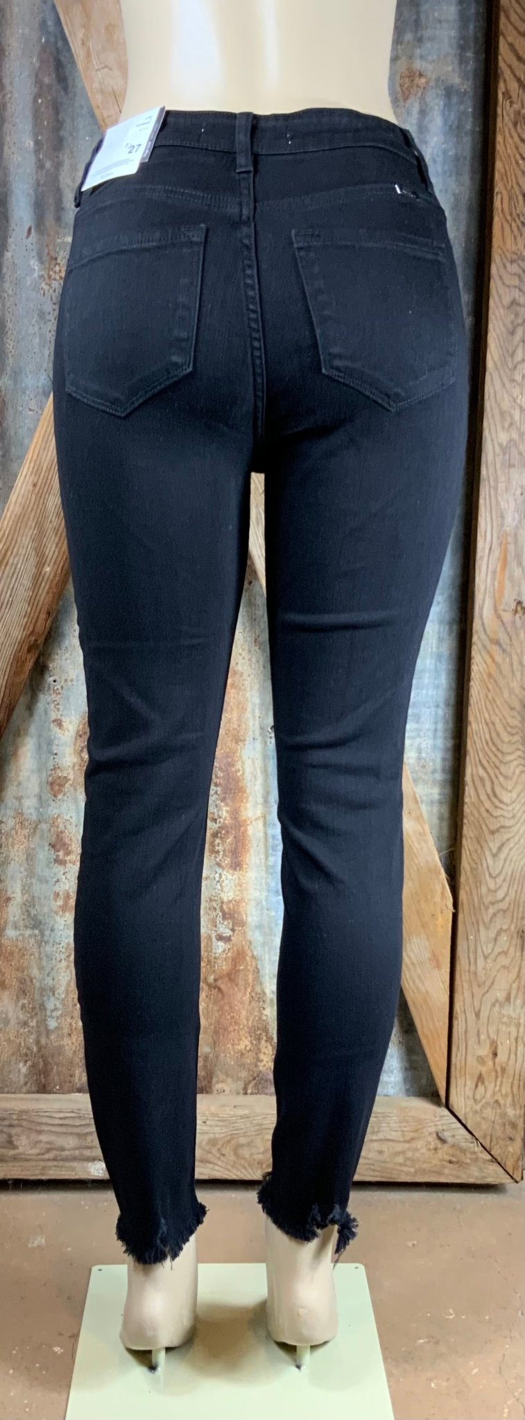 KanCan brand. These black skinny jeans are high rise with button fly. So stretchy that downsizing is suggested.