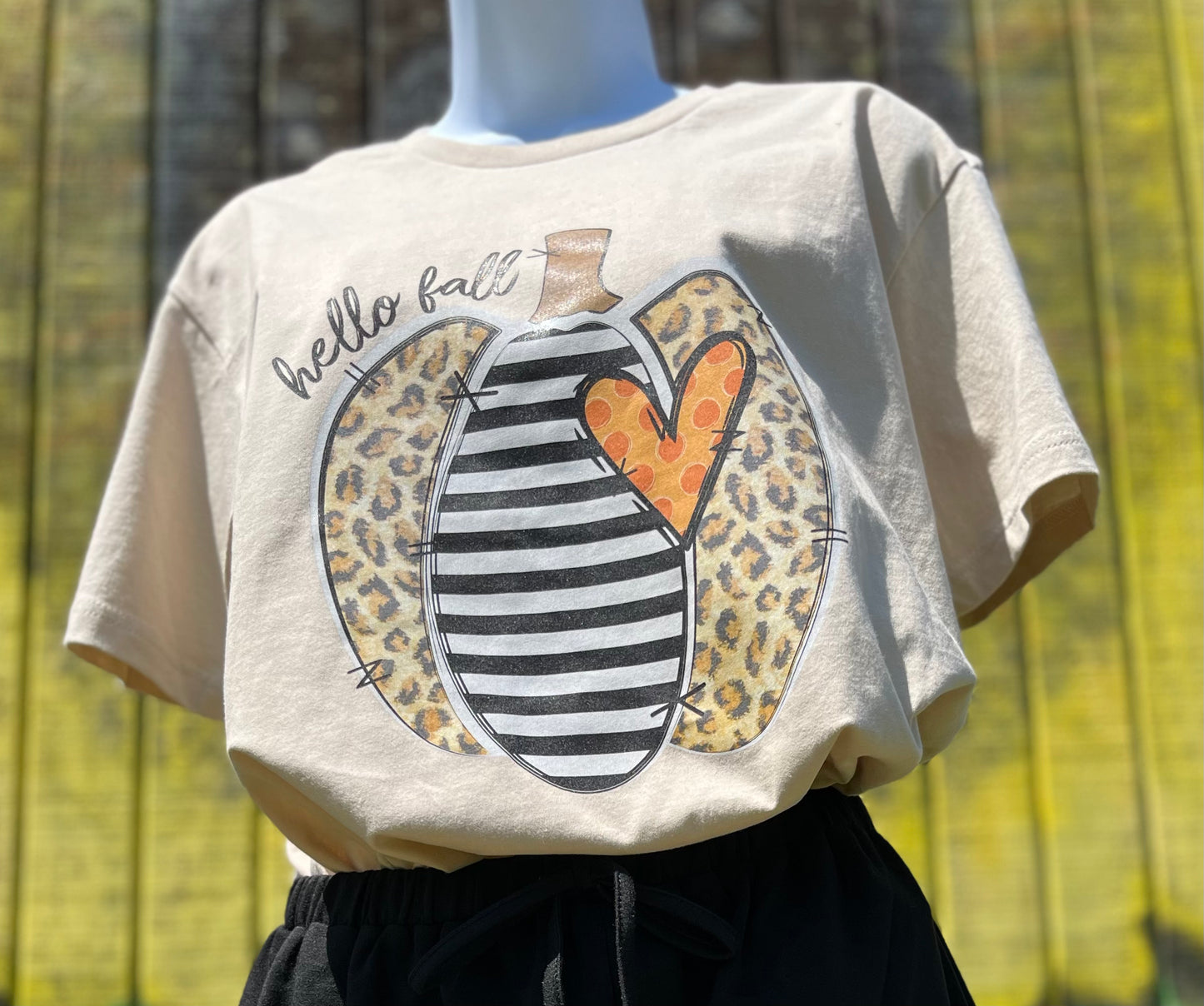 Southern Attitude Designs brand. Fall beige tee with leopard and striped pumpkin with orange polka dot heart.  S, M, L, XL, 2XL. $25