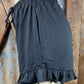 Main Strip brand. Drawstring tie waisted shorts with ruffled bottom hem. Loose fit. Available in Dusty Rose and Black.