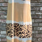 Shiying Fashion brand. This cream t-shirt dress is a mix of solid, leopard print and tie dye design with a v-neck and relaxed A-line silhouette. 95% polyester. 5% Elastane. Hand Wash. S, M, L, XL. $26