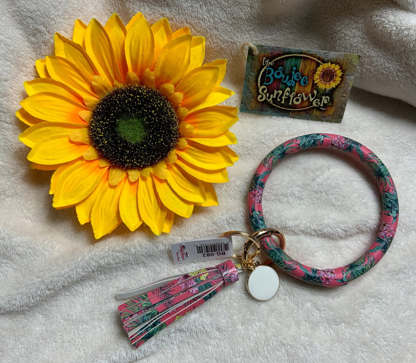 REMOVED BRAND brand. Tropical print key ring with tassel in pinks, aqua and green. Gold tone ring accents. $8