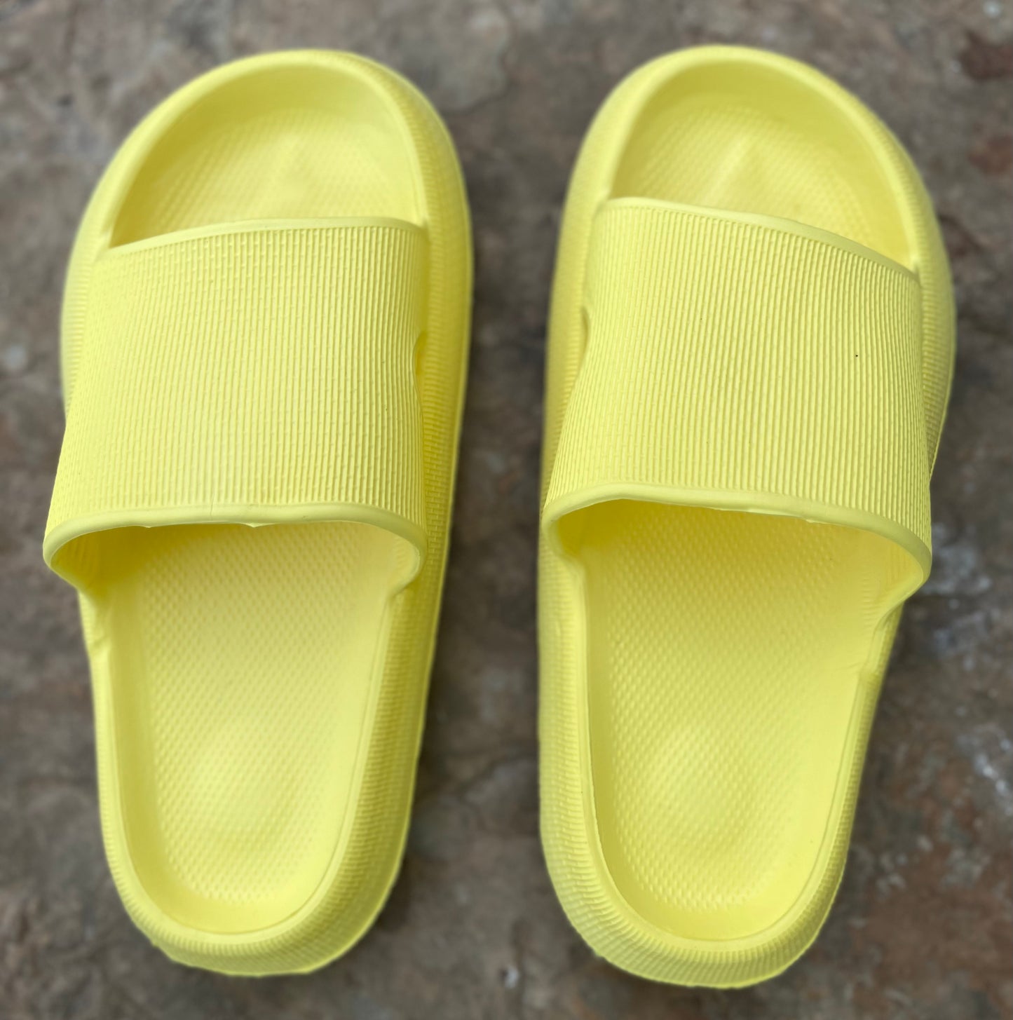 Shop Lev brand. Yellow rubber platform slides with cushioned design and shock absorption and anti-slip sole. Durable and quick drying. Sizes: 6, 7 8, 9, 10. $15