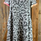 Celeste Clothing brand. Bluish gray knit with leopard print and multicolored trim around neck and short sleeves. S, M, L $20