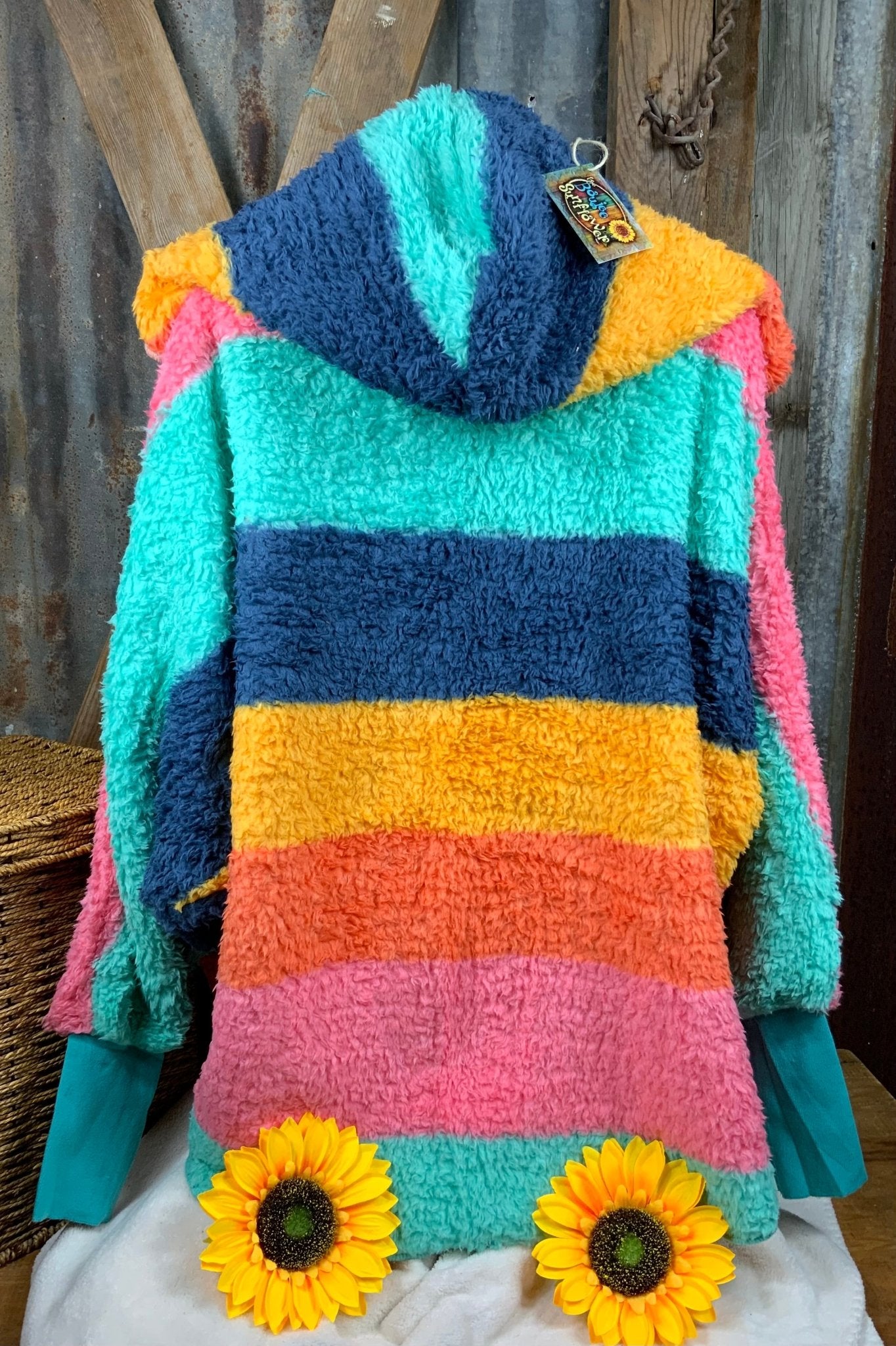 Katydid brand. Lightweight rainbow hoodie wrap with pockets in aqua, navy, pink, gold and orange. One size. $30