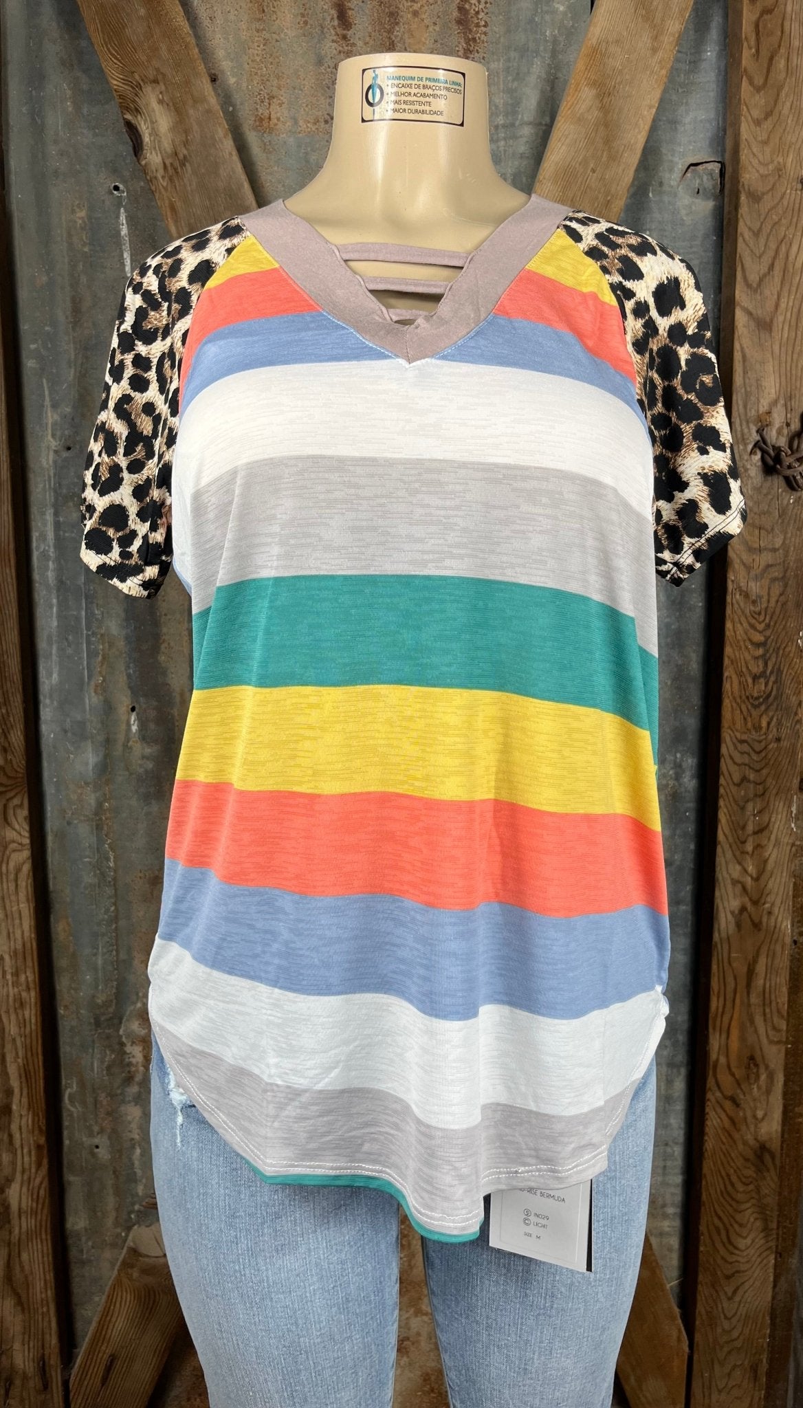 Celeste Clothing brand. Mocha cut out V-neck, multicolored block stripes and contrasting leopard short sleeves.