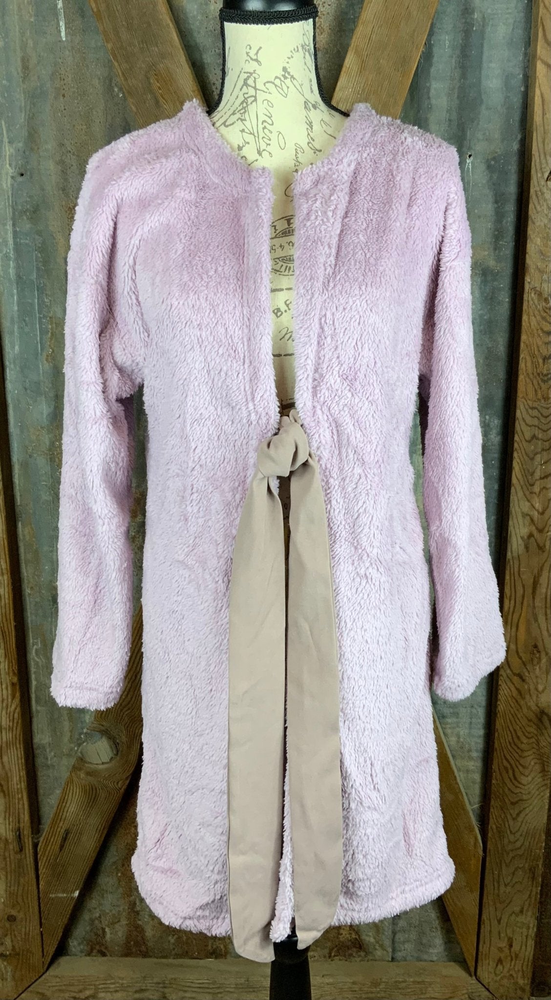 Melody brand. Mid-length, open front, ribbon tie fleece wrap in Lavender.  S, M, L $35