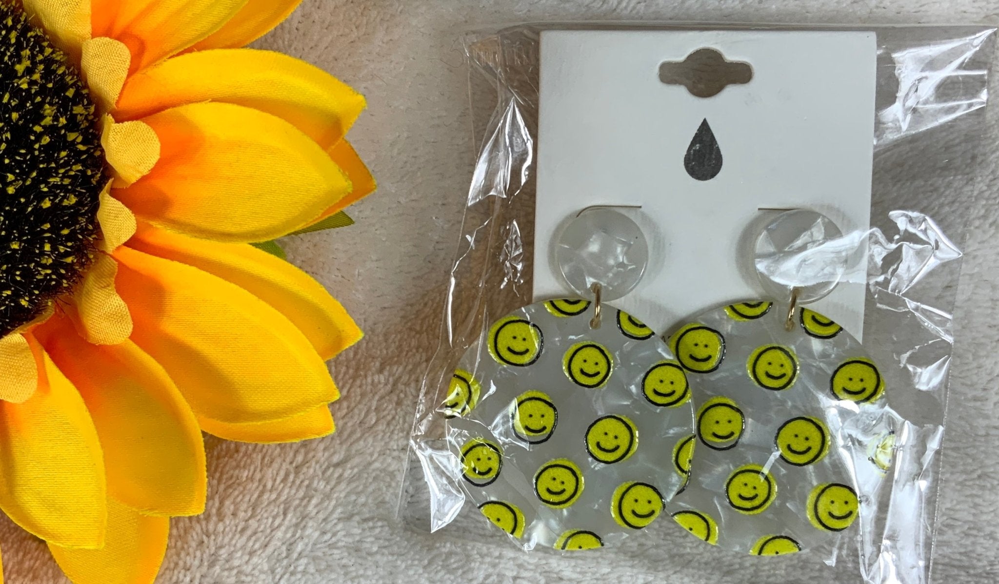 Avenue Zoe brand. Available in black or white hard resin with yellow happy faces and post back earrings. $10