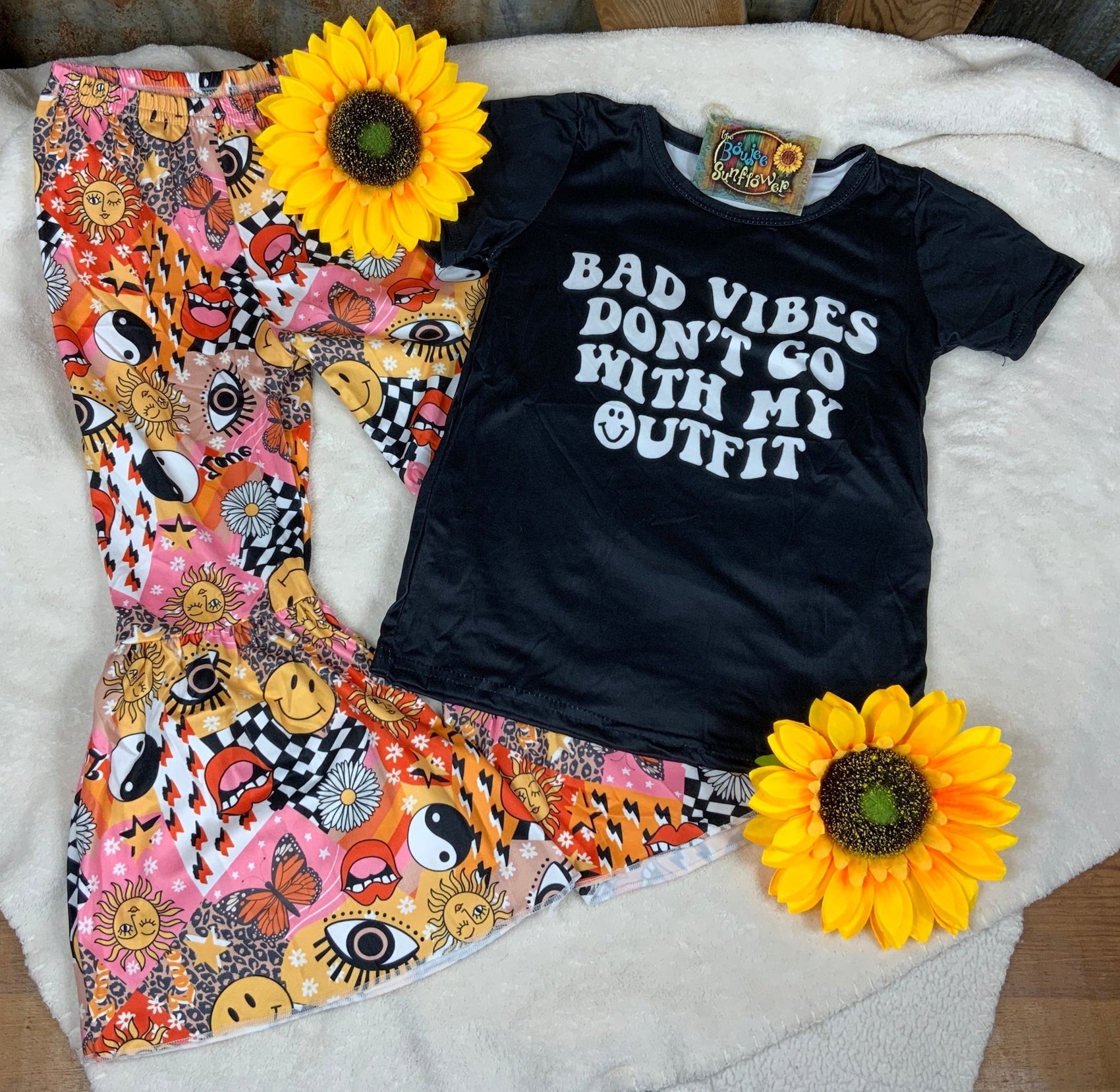 Yawoo Garments. Toddler. "Bad Vibes Don't Go With My Outfit" top with multi symbol patterned bell elastic waist pants.