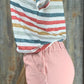 ESLEY brand. High-waisted, light wash denim. Available in blush or blue. Top clasp w/ elastic waist, pockets & shredded hem.