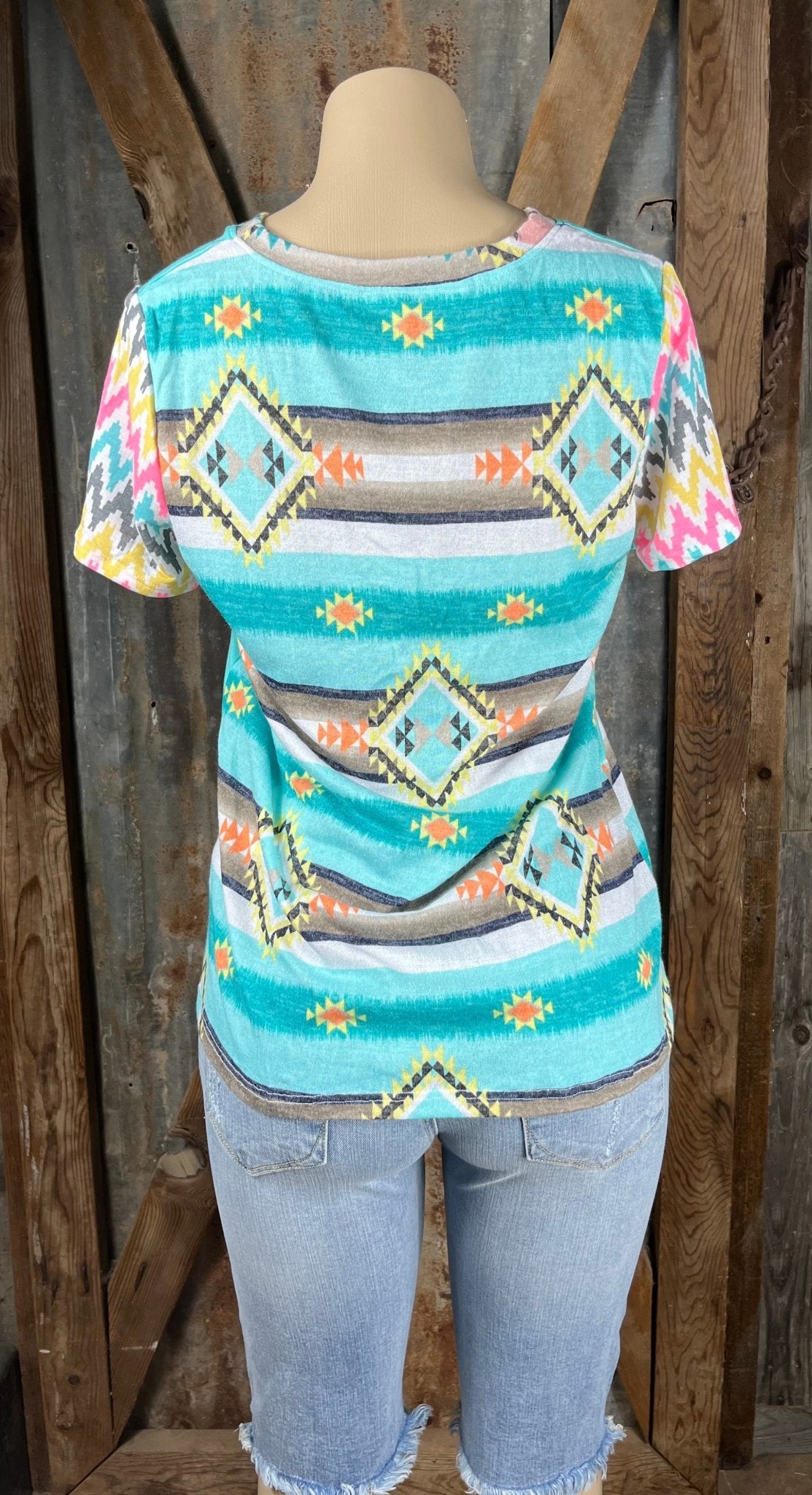 Celeste Clothing brand. This mint top has Aztec and mixed pattern multicolored designs and colorful chevron short sleeves.