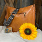 LivFoxy brand. Tan color with leopard print strap Sydney crossbody. Outer open pocket and zippered pouch. $35