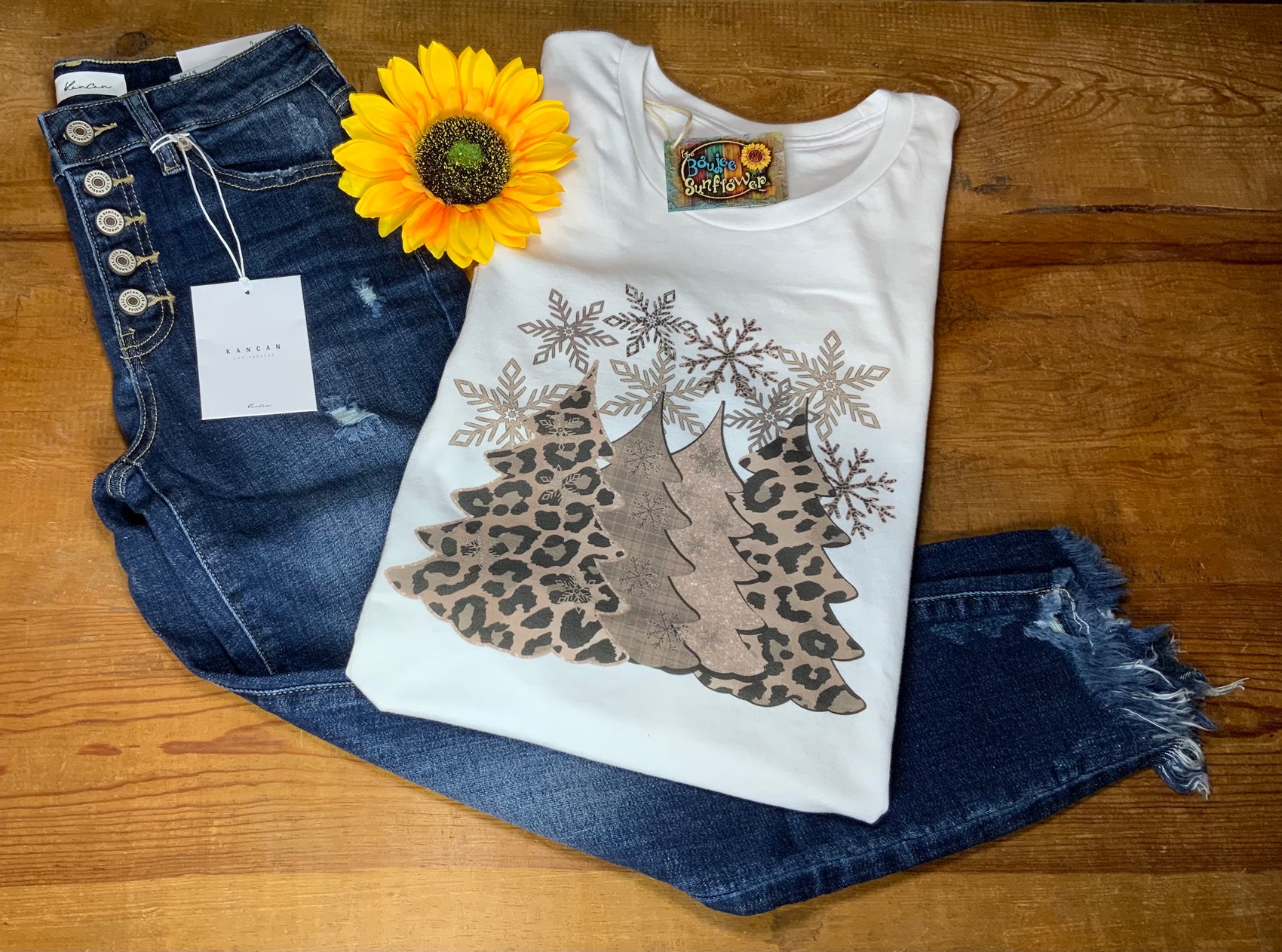 Midwest Tees brand. White tee with simulated glittered leopard Christmas trees and tan shaded snowflake trees with bigger snowflake detail. S, M, L, XL, 2X, 3XL. $24