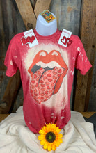 Wandering Owl Designs brand. Red bleached sublimation tee with mouth and hearted tongue design. S, M, L, XL, 2XL. $18