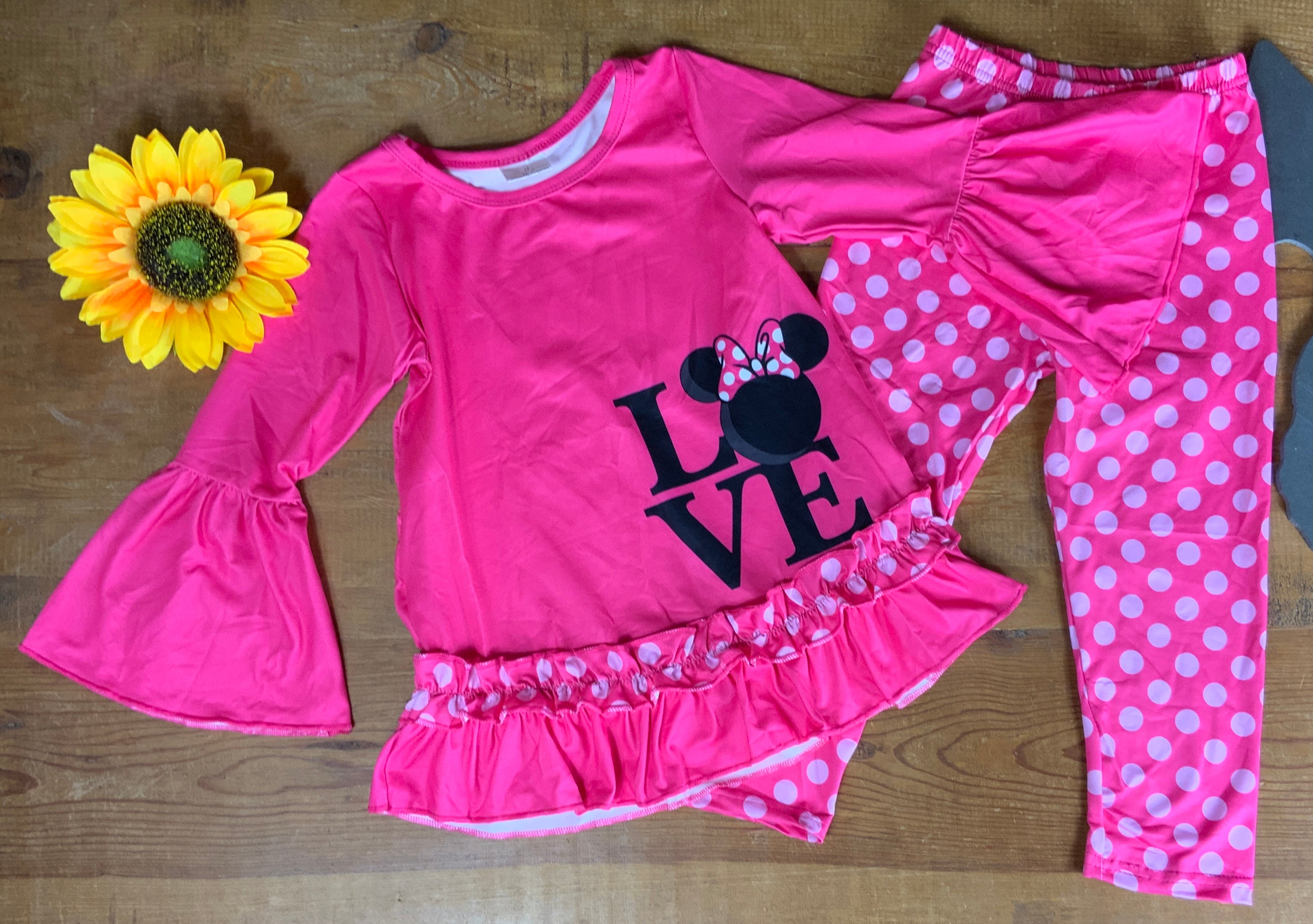 Yawoo Garments brand. Toddler. Hot pink belle long sleeved top with Minnie Mouse love black detail and polka dot ruffle with hot pink elastic waist and polka dot leggings. Sizes 3T and 4T. $15