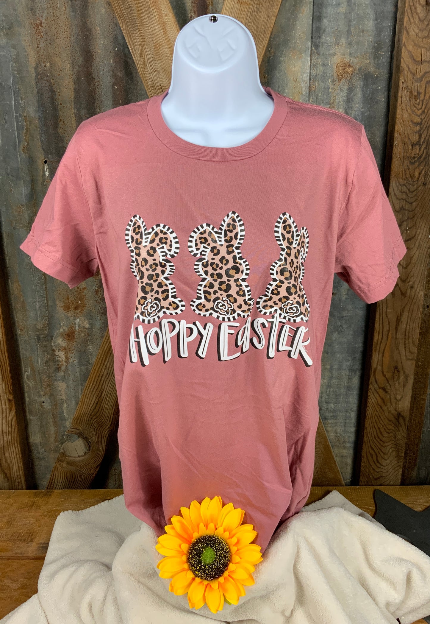 Anagails brand. Mauve tee with three leopard bunnies with black and white detail and "Hoppy Easter". S, M, L, XL, 2XL. $18